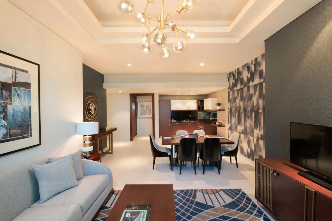 Wyndham Grand Doha West Bay Beach Exterior photo A living room at the hotel