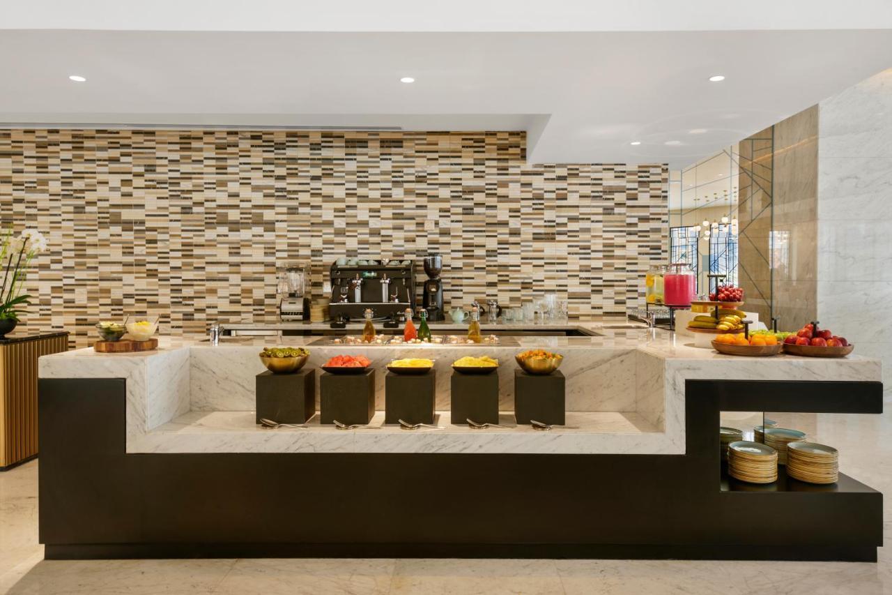 Wyndham Grand Doha West Bay Beach Exterior photo The Coffee Shop