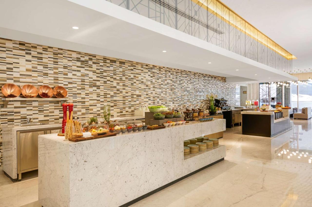 Wyndham Grand Doha West Bay Beach Exterior photo The buffet at the lobby